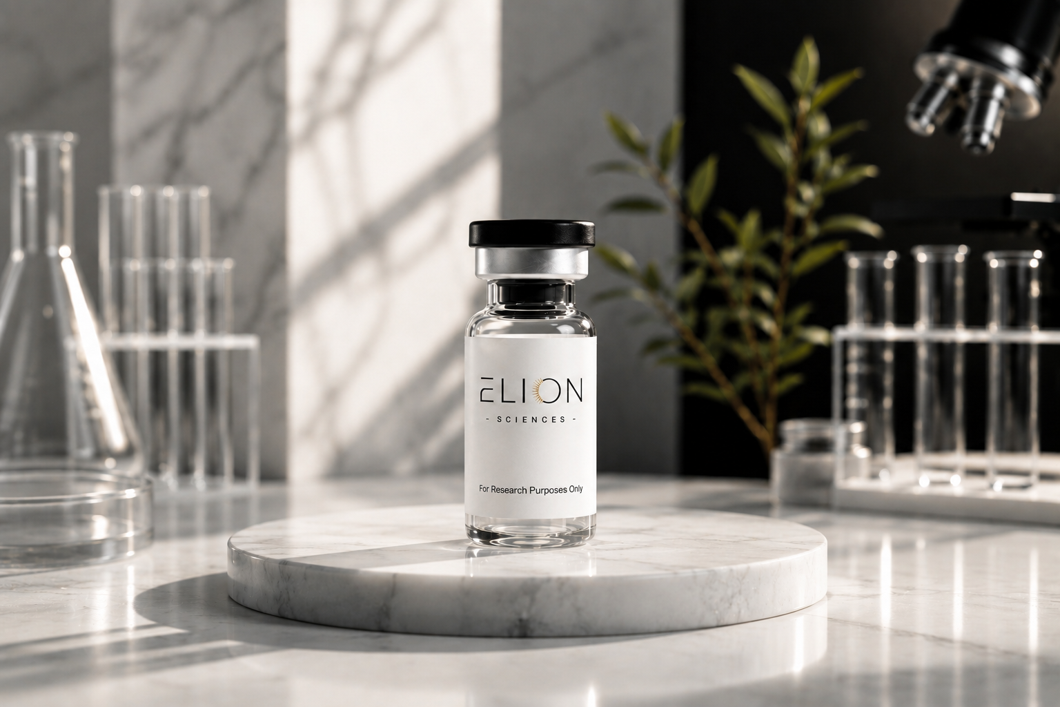 Elion Sciences research vial with a white branded label and black cap displayed on a round white marble platform, surrounded by laboratory glassware and a microscope in a softly lit modern research setting.